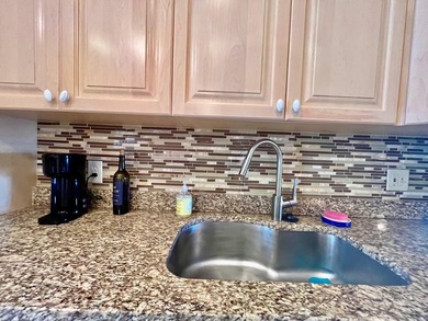 Welcome to this charming two-bedroom, two-bathroom condominium - photo 14