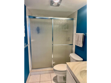 Welcome to this charming two-bedroom, two-bathroom condominium - photo 21