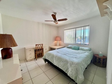 Welcome to this charming two-bedroom, two-bathroom condominium - photo 24
