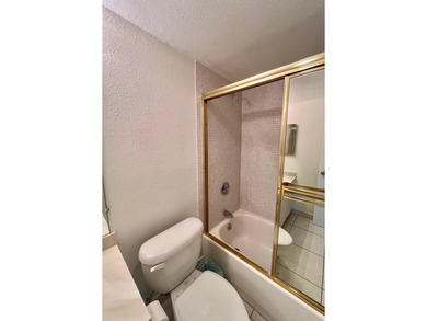 Welcome to this charming two-bedroom, two-bathroom condominium - photo 27