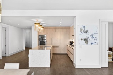 Positioned as a refined corner residence, this professionally