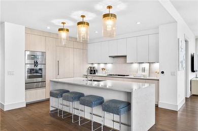 Positioned as a refined corner residence, this professionally