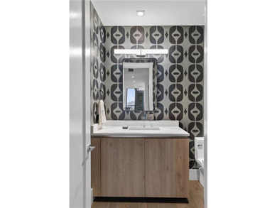 Positioned as a refined corner residence, this professionally