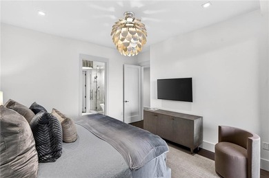 Positioned as a refined corner residence, this professionally