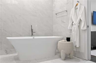 Positioned as a refined corner residence, this professionally