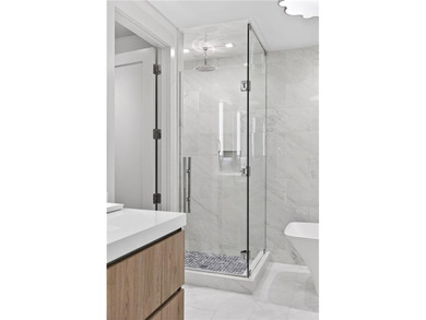 Positioned as a refined corner residence, this professionally