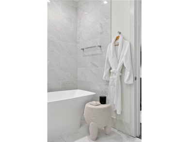 Positioned as a refined corner residence, this professionally