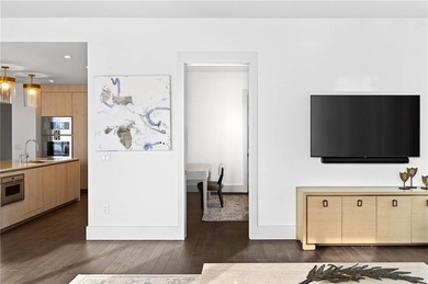 Positioned as a refined corner residence, this professionally