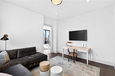 Positioned as a refined corner residence, this professionally