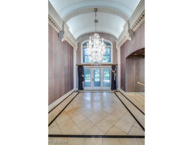Step into an extraordinary two-story foyer where timeless - photo 6