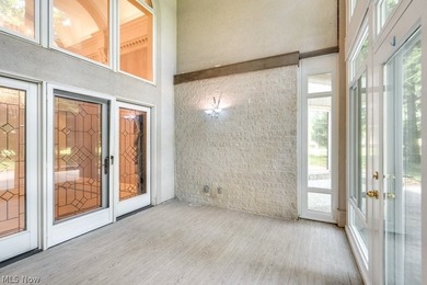 Step into an extraordinary two-story foyer where timeless - photo 8
