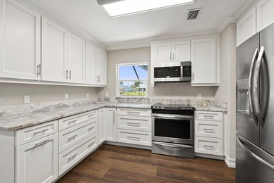 This beautifully maintained waterfront property offers a rare - photo 6