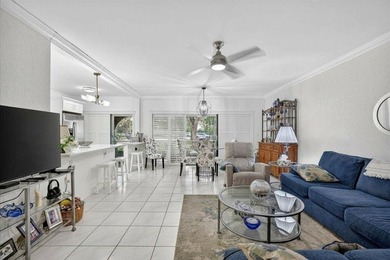 This spacious 2/2 ground-floor condo offers the perfect blend of - photo 2