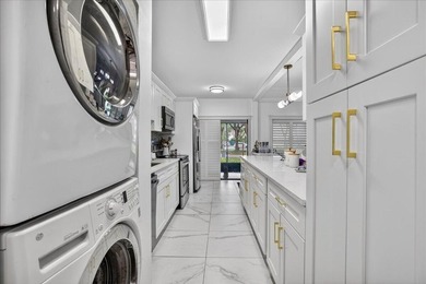 This spacious 2/2 ground-floor condo offers the perfect blend of - photo 9