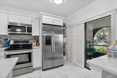 This spacious 2/2 ground-floor condo offers the perfect blend of - photo 10