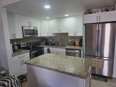 Beautifully updated first-floor 1-bedroom, 1.5-bath condo - photo 1