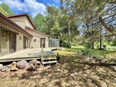 Surrounded by towering pines and overlooking a private pond - photo 1