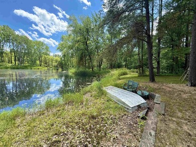 Surrounded by towering pines and overlooking a private pond - photo 2