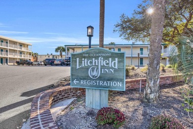 Located on the pristine sands of Litchfield Beach, this charming - photo 2