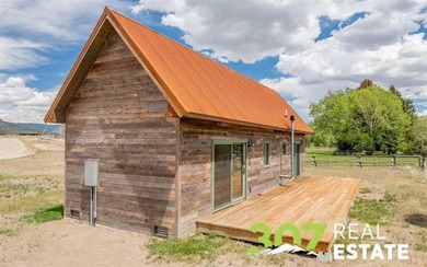 Set along the South Fork of the Shoshone River, this exceptional - photo 25
