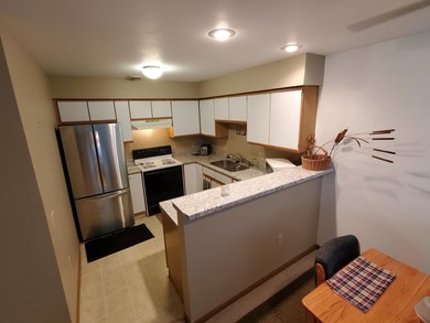 One-bedroom condo with an attached one car garage, outside - photo 7