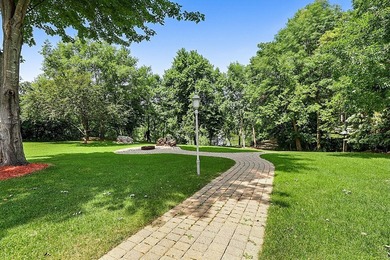 Experience an unparalleled lifestyle in this masterfully crafted - photo 3