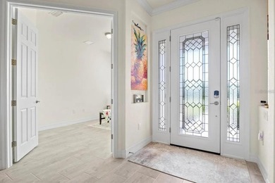 Tucked behind the gates of Harbor West, this exceptional - photo 6
