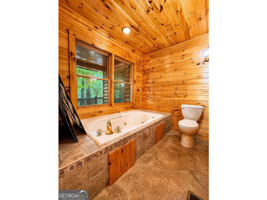 Tucked into a private wooded setting on top of the mountain in - photo 16