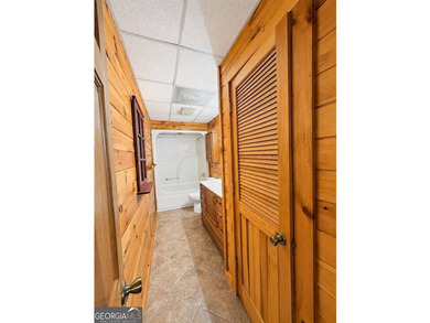 Tucked into a private wooded setting on top of the mountain in - photo 18