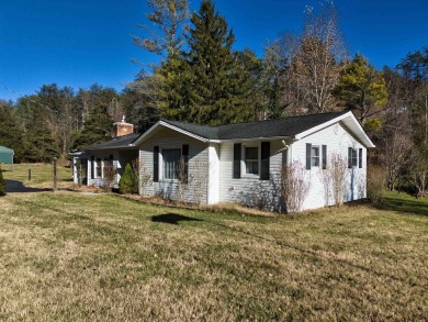 Charming 3 bedroom, one level home on over 5 ACRES WITH CREEK &