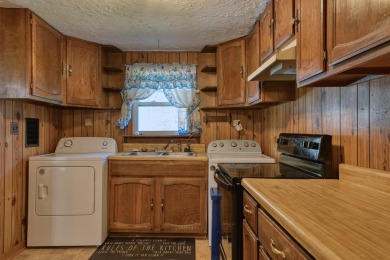 Charming 3 bedroom, one level home on over 5 ACRES WITH CREEK &