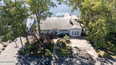 Location, location, location! This rare waterfront home sits - photo 3