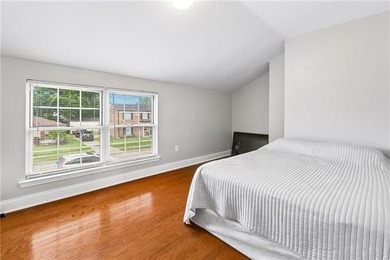 Fully renovated in 2021, this 4-bedroom, 2.5-bath home offers a - photo 11