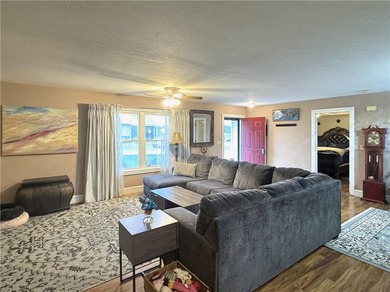 This 3 bedroom 2 bathroom ranch home is located within the gated - photo 2