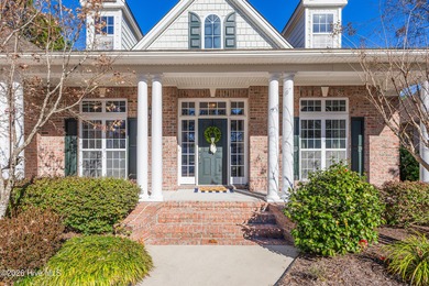 This elegant all-brick, one-level home is perfectly situated in