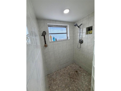 Welcome to this charming condominium located at 8785 SW 137th