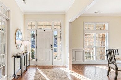 This elegant all-brick, one-level home is perfectly situated in