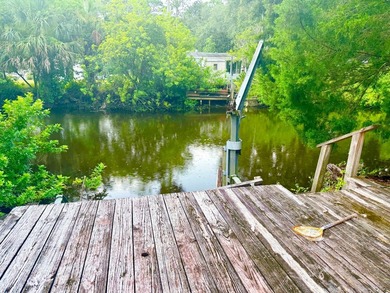 Waterfront 3 bedroom 2 bath with Deck & small Boat Lift - photo 12