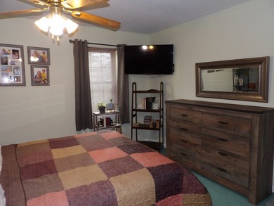 Well-maintained property featuring a 14' RV carport with hookups - photo 14