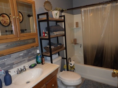 Well-maintained property featuring a 14' RV carport with hookups - photo 16