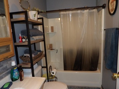 Well-maintained property featuring a 14' RV carport with hookups - photo 17