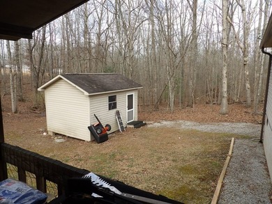 Well-maintained property featuring a 14' RV carport with hookups - photo 23