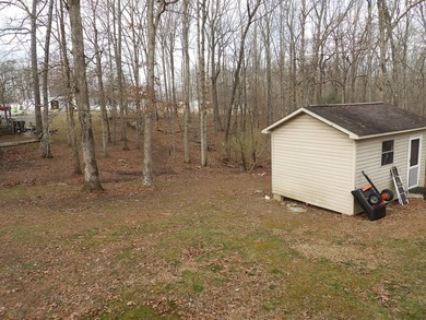 Well-maintained property featuring a 14' RV carport with hookups - photo 24