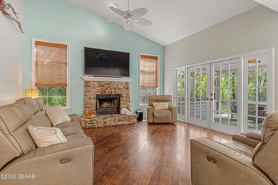 Tucked away on over an acre of beautifully wooded privacy, this - photo 3