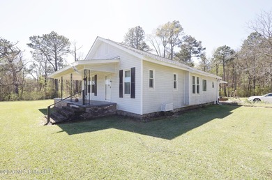 Country home nestled on 4.48 acres, features a pond and ample - photo 27