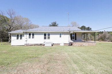 Country home nestled on 4.48 acres, features a pond and ample - photo 30