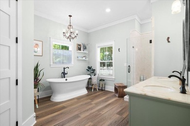 This coastal custom home is set on a protected bayou with serene - photo 11