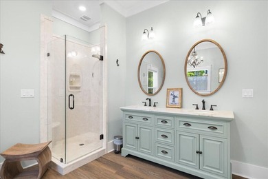 This coastal custom home is set on a protected bayou with serene - photo 12