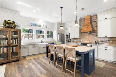 This coastal custom home is set on a protected bayou with serene - photo 15