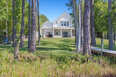 This coastal custom home is set on a protected bayou with serene - photo 36